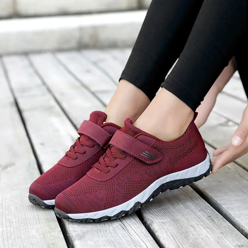 Women's low-top wedge shoes with Velcro strap and mesh upper in a solid colour