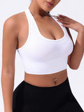 Black women's cross back sports bra with fixed double straps and molded cups.
