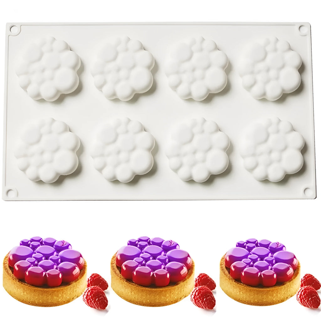 Round silicone cake mould with 8 bubble tower pattern design on a kitchen worktop.