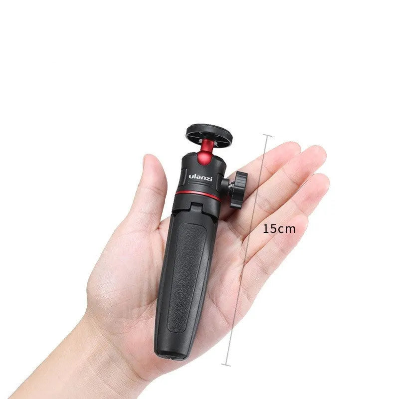 Black red and white aluminium and ABS plastic desktop tripod with extended selfie stick for mobile phones.