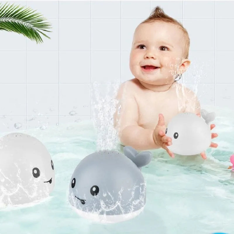 Electric induction whale spray bath toy with automatic water sensing, flashing light, and music functions