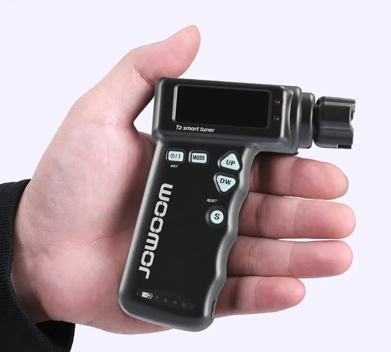 Black and white multi-function smart guitar tuner and electric string winder with LCD display.