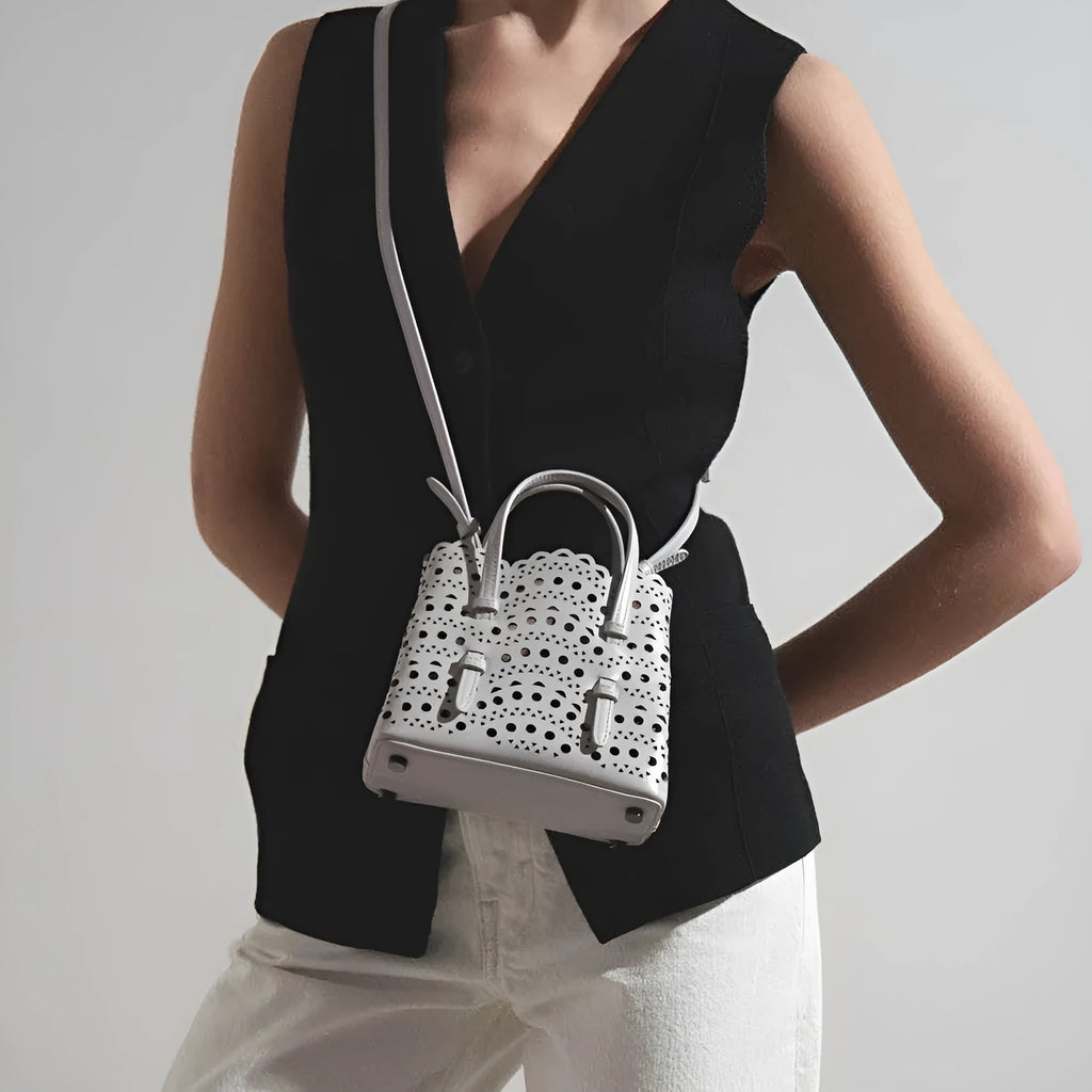 Hollow carved shoulder messenger bag in horizontal square shape with three straps in choice of eleven colours