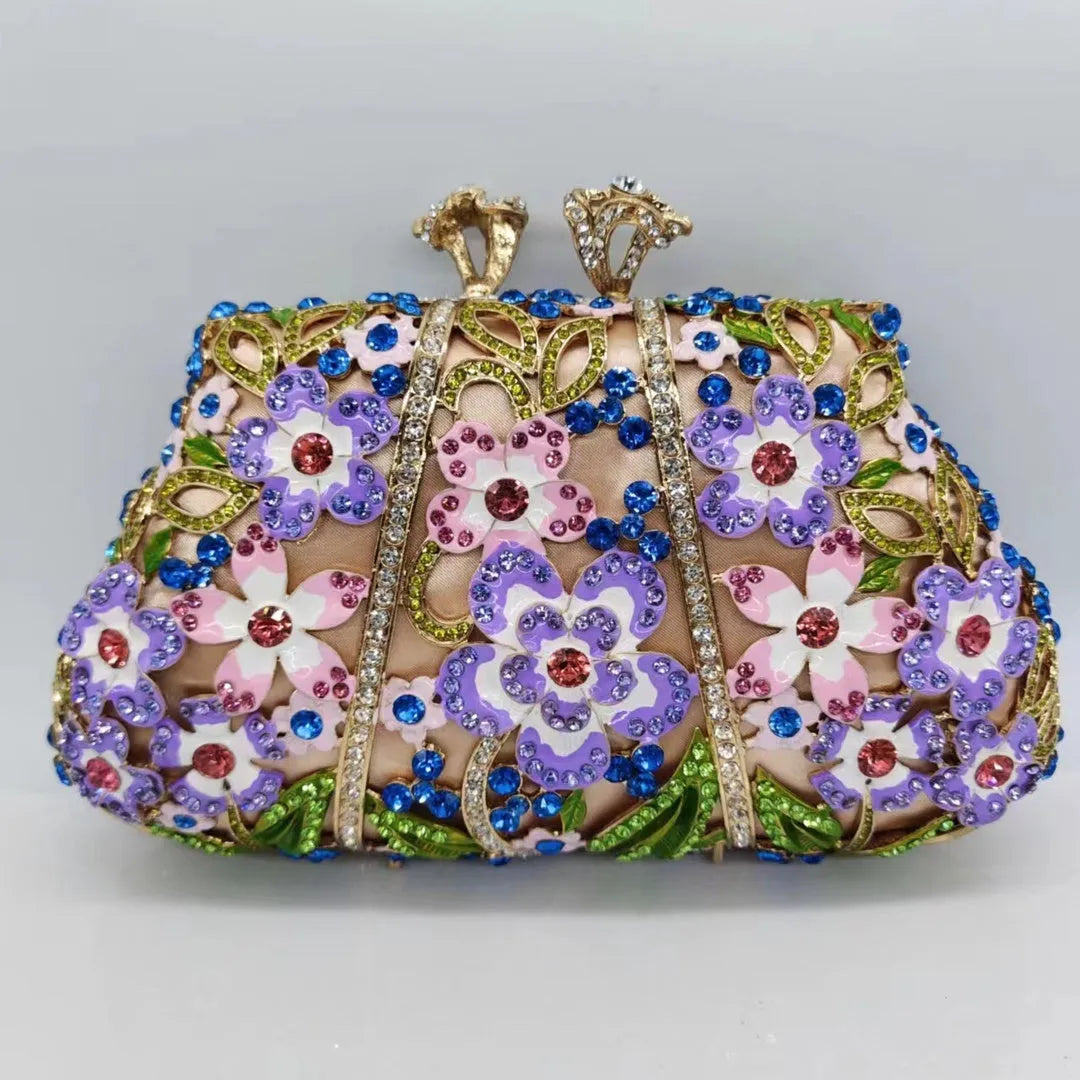 Gold oval metal evening clutch with enamel flower, hollow, diamond and dripping oil detail, 22cm long