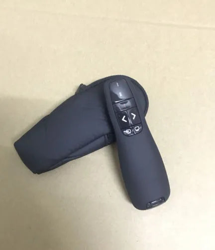 Black wireless laser pointer remote control for presentations with USB receiver stored inside