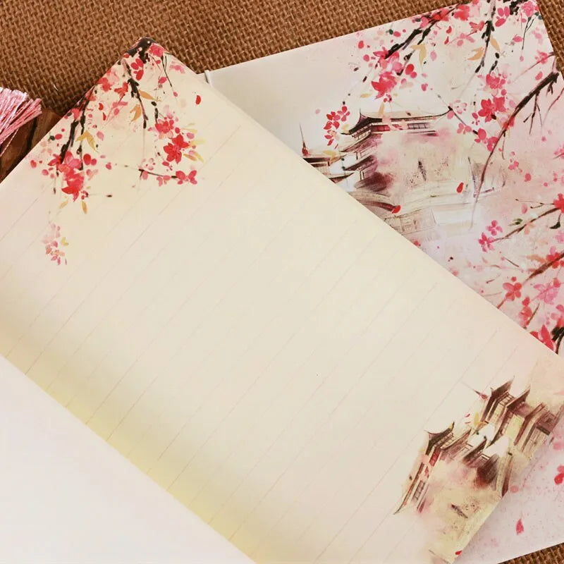 Chinese style thread-bound notebook with watercolour azalea design on cover, showing traditional binding