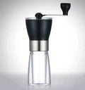Manual ceramic burr coffee grinder and pepper mill with adjustable settings, 6cm diameter.