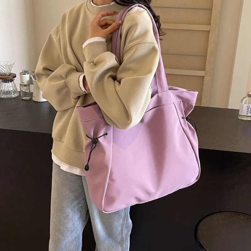 Soft foldable Oxford cloth tote bag in street style, shown in a choice of five colours.