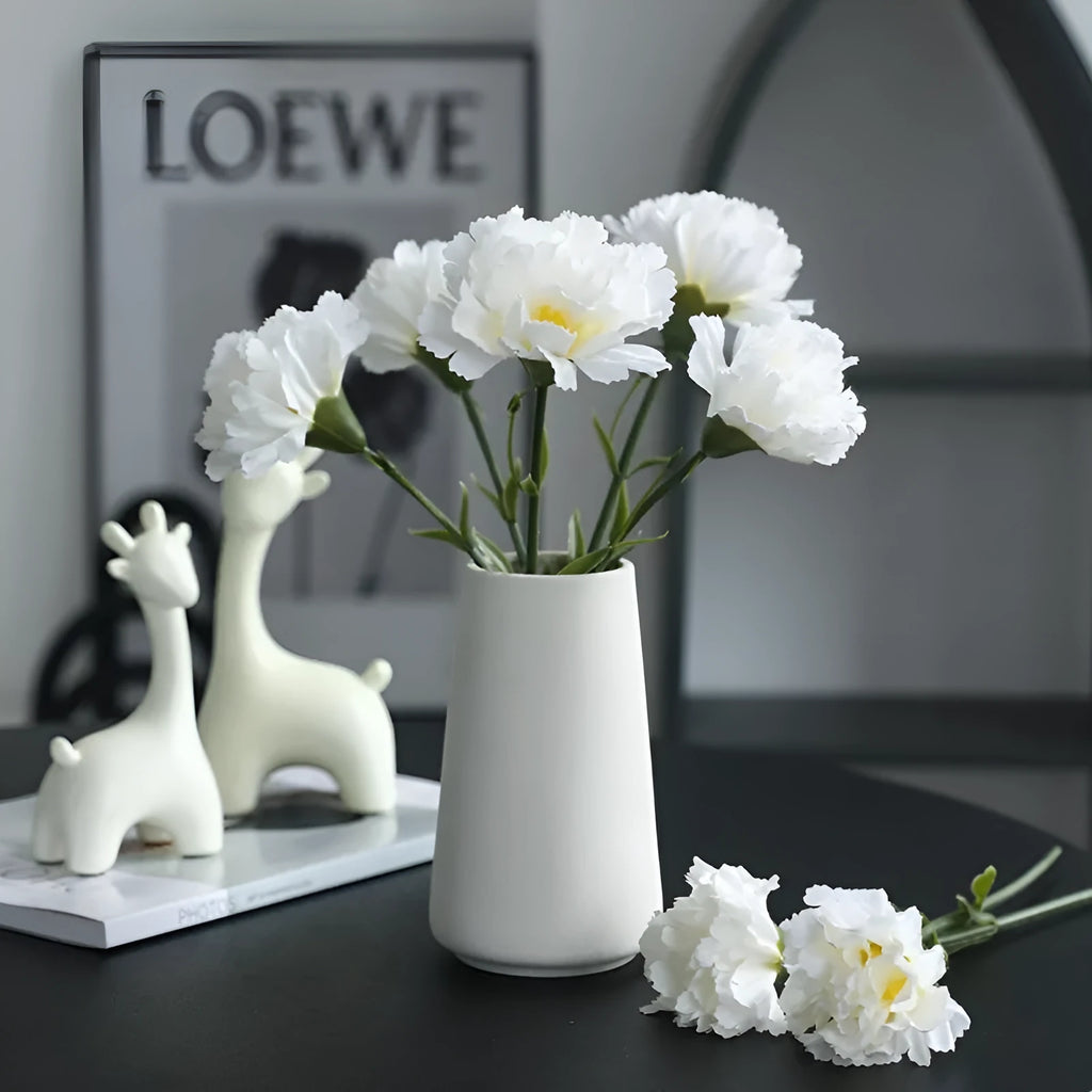 Artificial carnation flower with silk petals on soft rubber base in four colour options