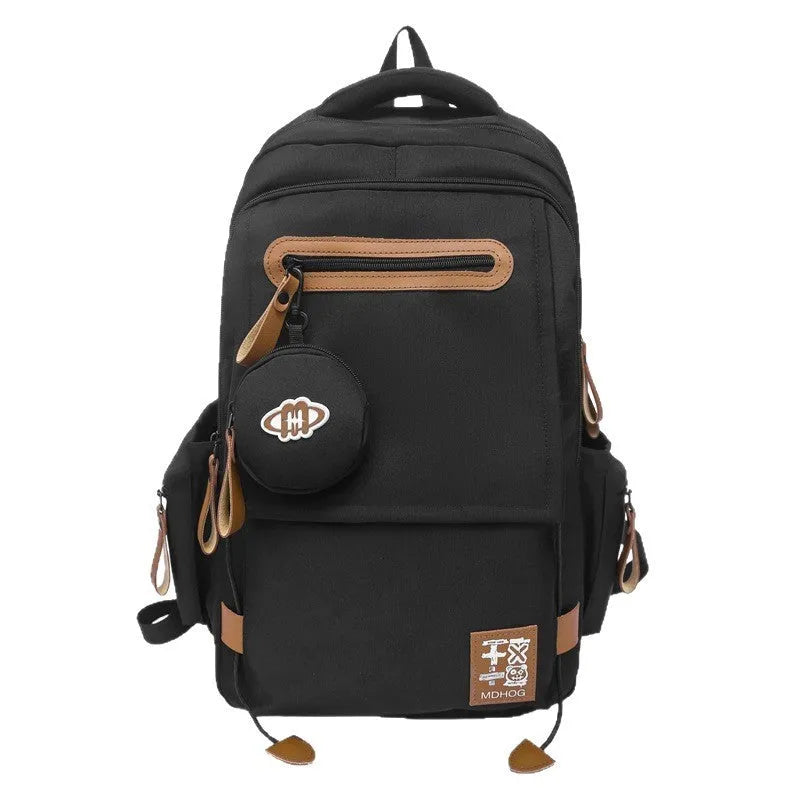 Large waterproof travel backpack in black with contrast colour stitching showing 20-35 litre capacity