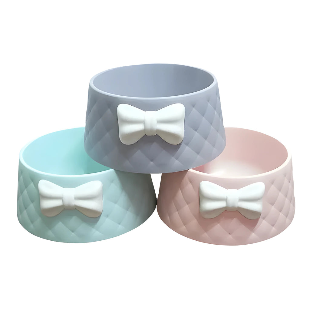 Bow-shaped cat bowl dog bowl in PP plastic, shown in pink, green, and grey.
