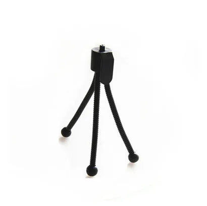 Mini tripod with universal ball head folded to 110mm size next to smartphone showing compatibility