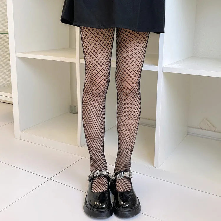 Women's mesh stockings showing large, medium, and small net patterns in black and white colours