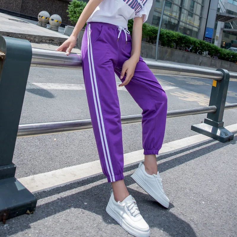 Women's cropped harem track pants in thin polyester, mid waist, solid colour, sizes S to 3XL