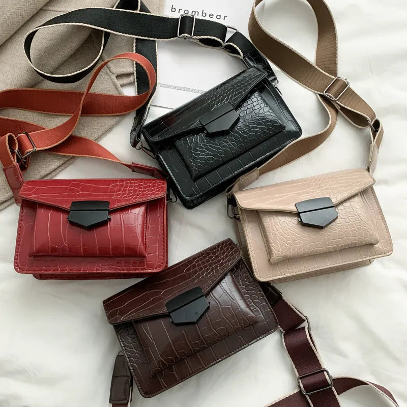 Vintage crossbody bag in black with adjustable strap, showing 20cm width and 14cm height