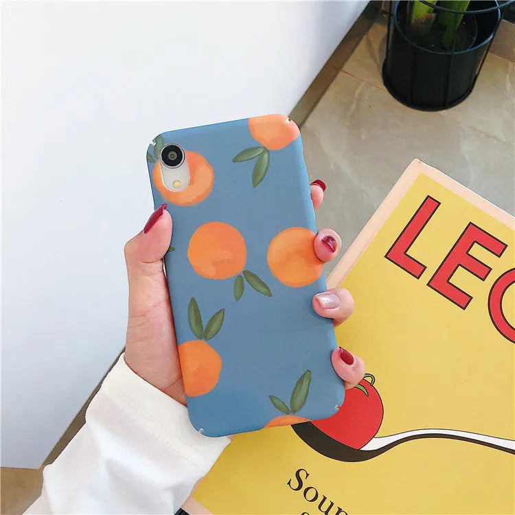 Bright orange plastic iPhone case with a retro water and blue background design
