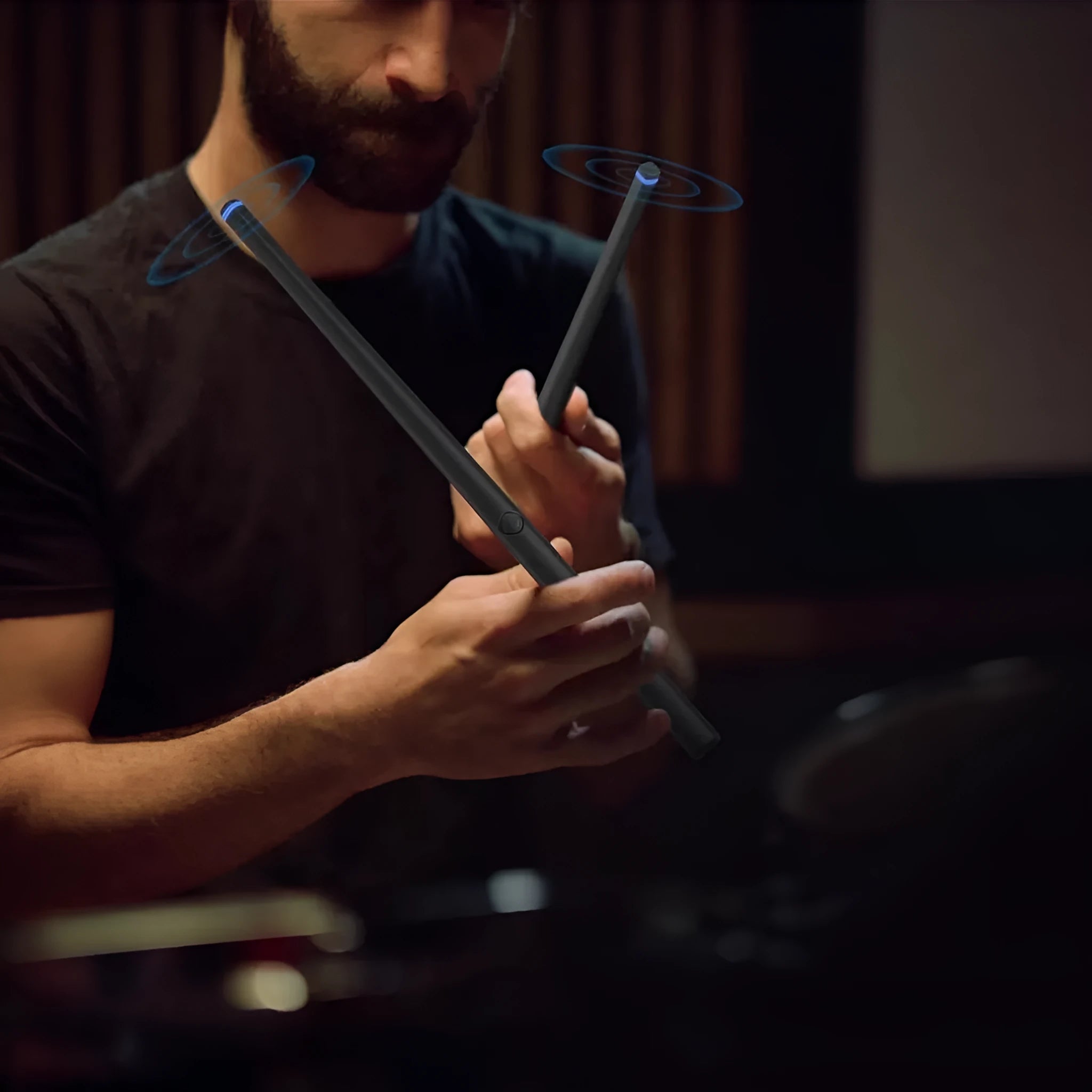 Black wireless air drum kit with drumsticks and foam floor markers for virtual reality music creation