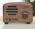 Vintage wood Bluetooth speaker in black finish showing compact 93mm height with control buttons