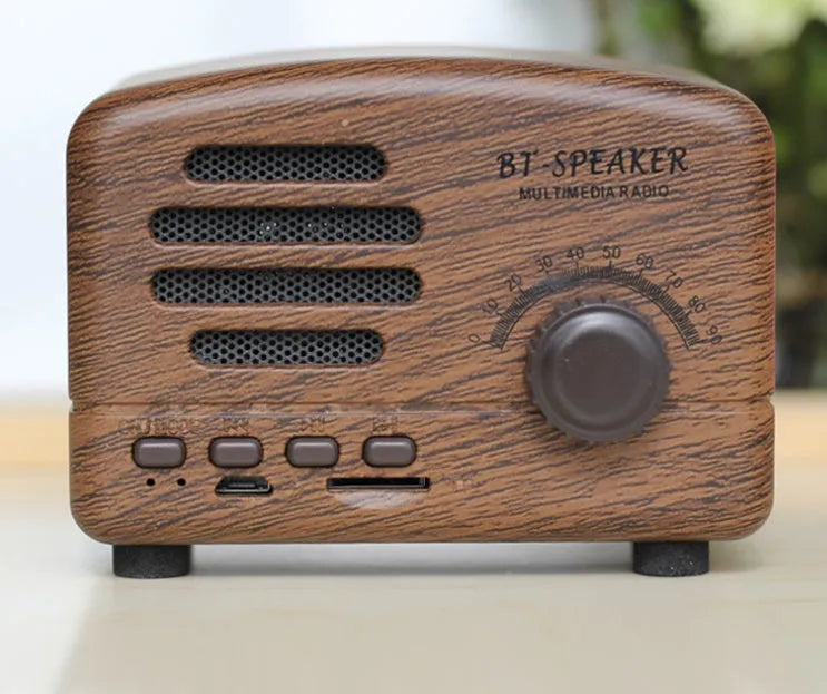 Vintage wood Bluetooth speaker in black finish showing compact 93mm height with control buttons