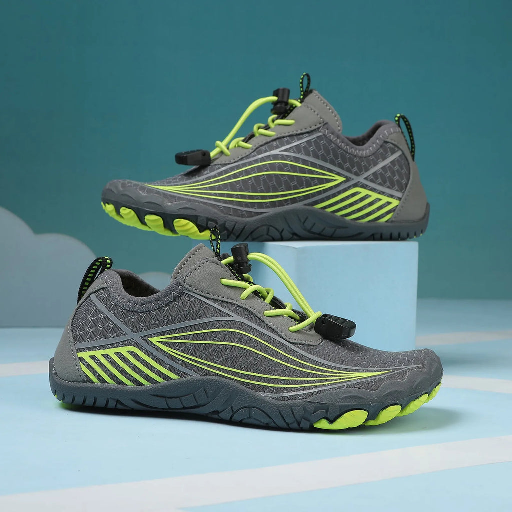 Children's black and grey quick-drying wading shoes with elastic band and rubber sole.