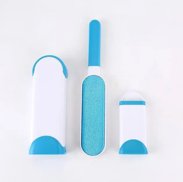 Blue reusable pet hair removal comb with double-sided flannel brush next to its self-cleaning base unit.