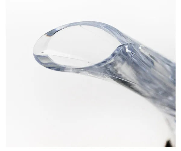 Wine aerator with stainless steel filter, measuring 16cm in length and 4.2cm in diameter, on a glass with red wine.