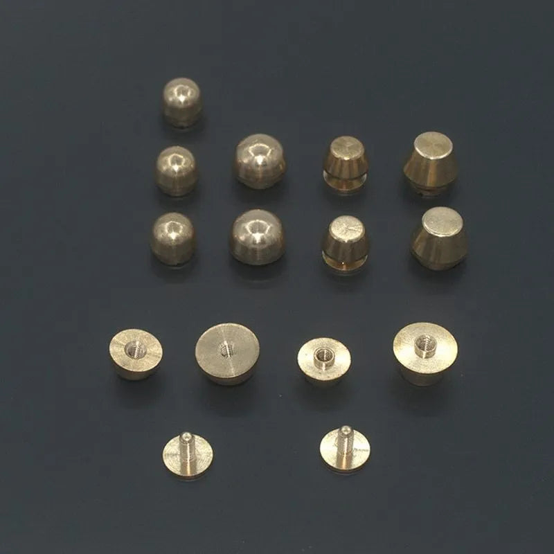 Brass decorative buckle for footwear showing 10x6mm and 12x7mm sizes in round and geometric shapes