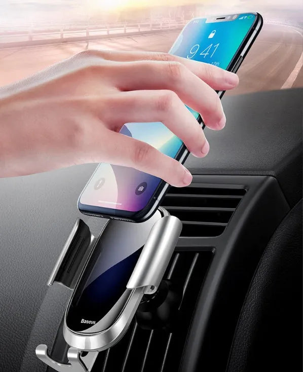 Smart car bracket with rotating ball head mounted on car air vent holding smartphone