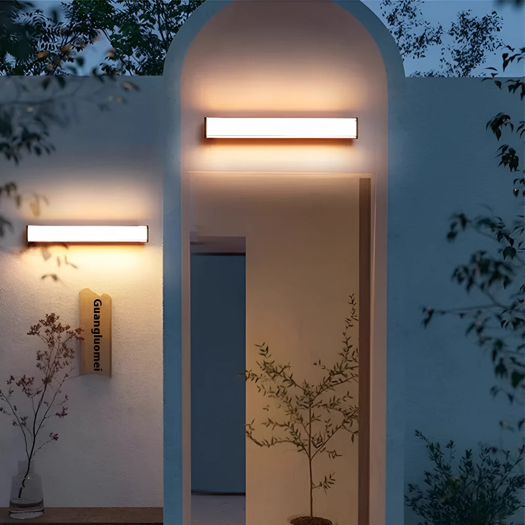 Modern minimalist LED outdoor wall lamp with IP65 waterproof rating shown in courtyard setting