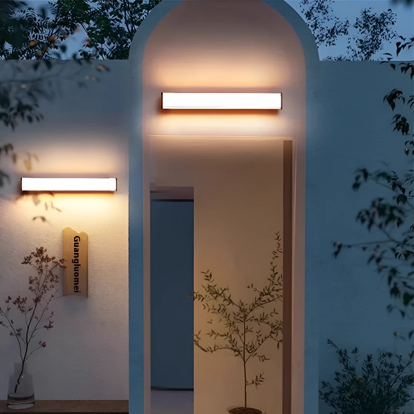 Modern minimalist LED outdoor wall lamp with IP65 waterproof rating shown in courtyard setting
