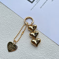 Love heart shaped acrylic charm keychain on an electroplated metal ring in silver finish.