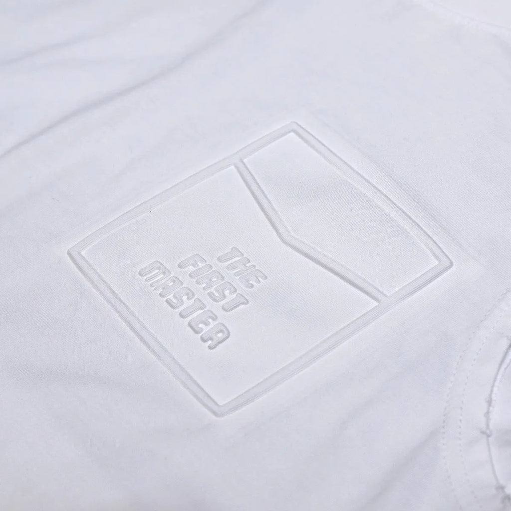Solid colour loose fit cotton sleeveless t-shirt on a hanger, shown in black and white colour options.