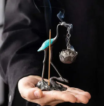 Chinese style gourd-shaped incense coil burner in copper alloy with dragon and phoenix design, painted blue or red top.