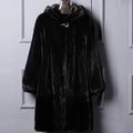 Women's long black hooded faux fur coat for autumn and winter, shown on a hanger.