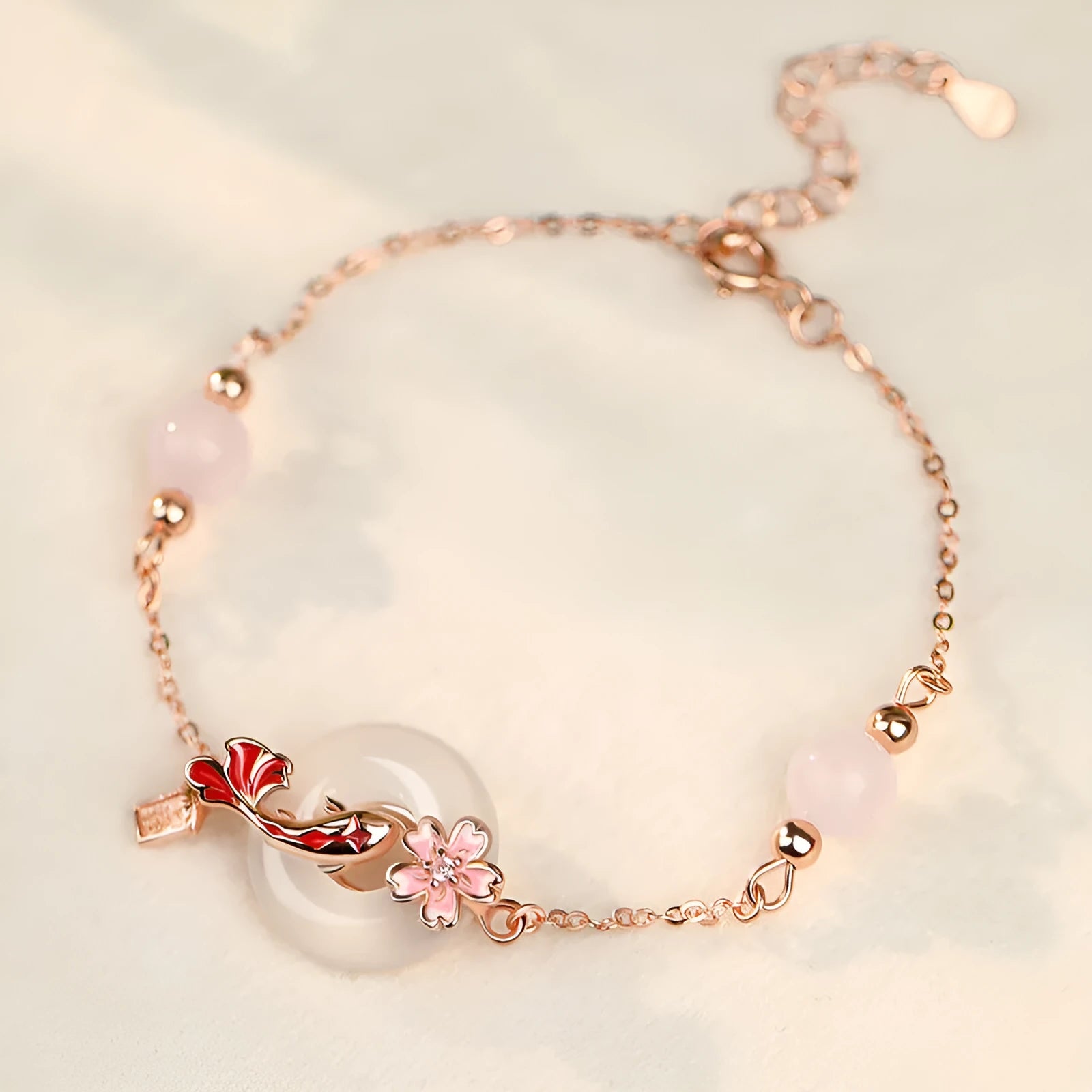 S925 sterling silver bracelet with white chalcedony crystal flower and engraved koi fish design.