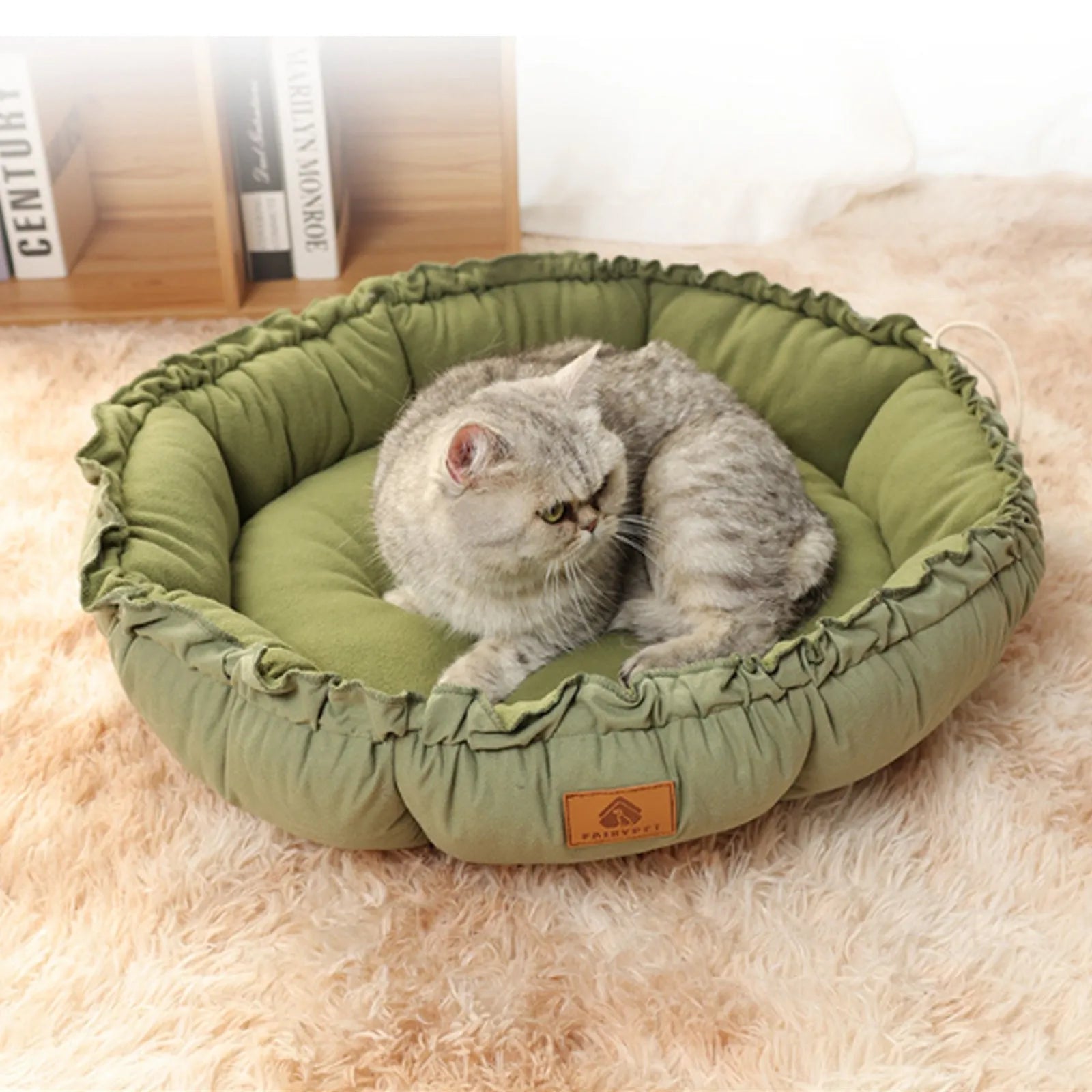 Reversible donut cat bed in grey or green colour, showing dual-use design and size options for indoor cats