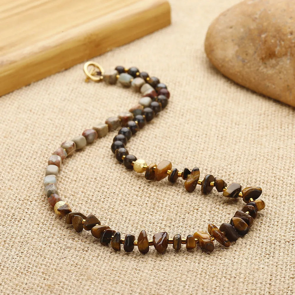 Handmade geometric bracelet made of Tigereye and bronze with bent wire texture, brown colour 3793.