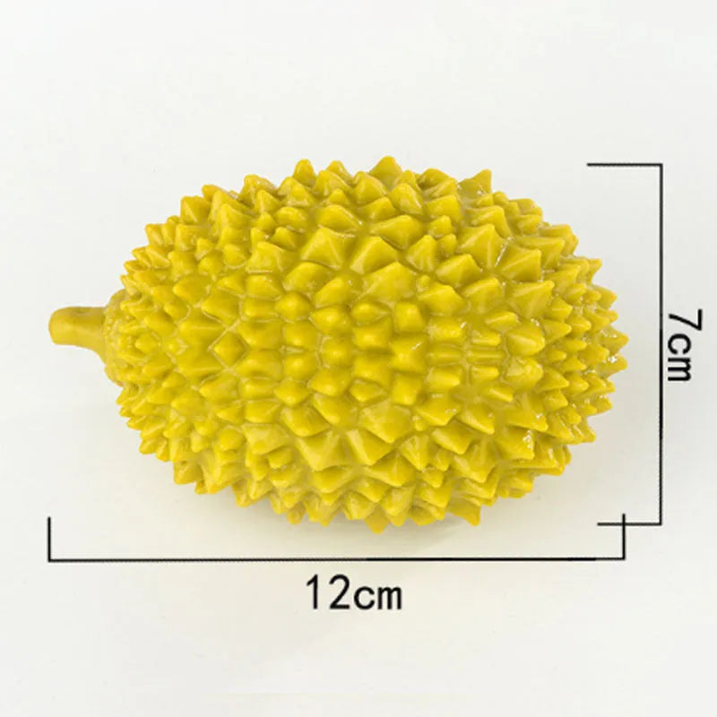 Durian-shaped dog chew toy in yellow with raised surfaces for teeth cleaning