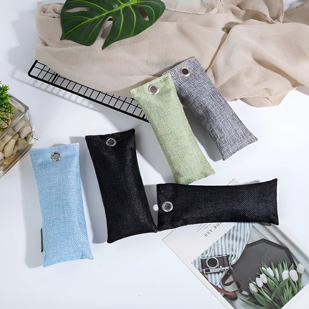 Black, blue, green, and grey linen charcoal deodoriser bags for shoes and household odour removal.