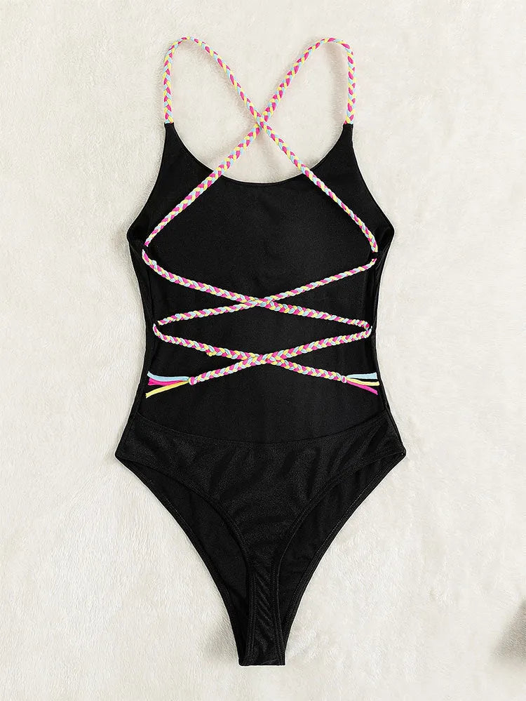 Black solid colour one-piece swimsuit with backless and sleeveless design.
