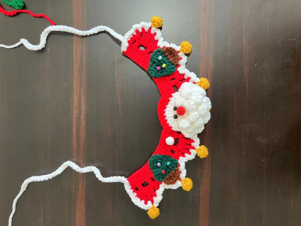 Knitted wool Christmas scarf for a small dog featuring a striped Santa Claus pattern.