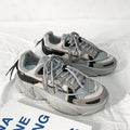 Men's white platform trainers with lace-up front and a breathable mesh lining, shown from the side.