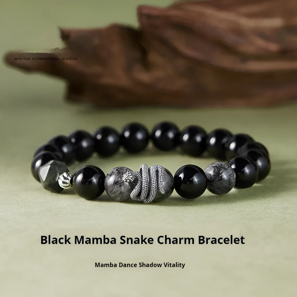 Men's retro snake bracelet in sterling silver with a large black obsidian stone on a dark background.