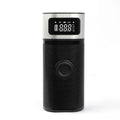 Black portable wireless smart air pump with LCD screen, LED light, inflation tube, and multiple nozzles on a white background.