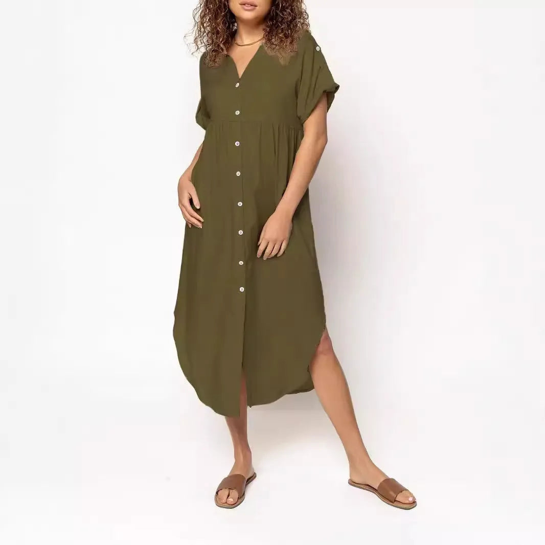 Loose-fit mid-length dress with button front in polyester fabric, available in multiple colours and sizes.