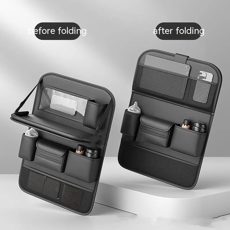 Black leather car seat storage bag with a foldable dining table deployed, hanging behind a car headrest