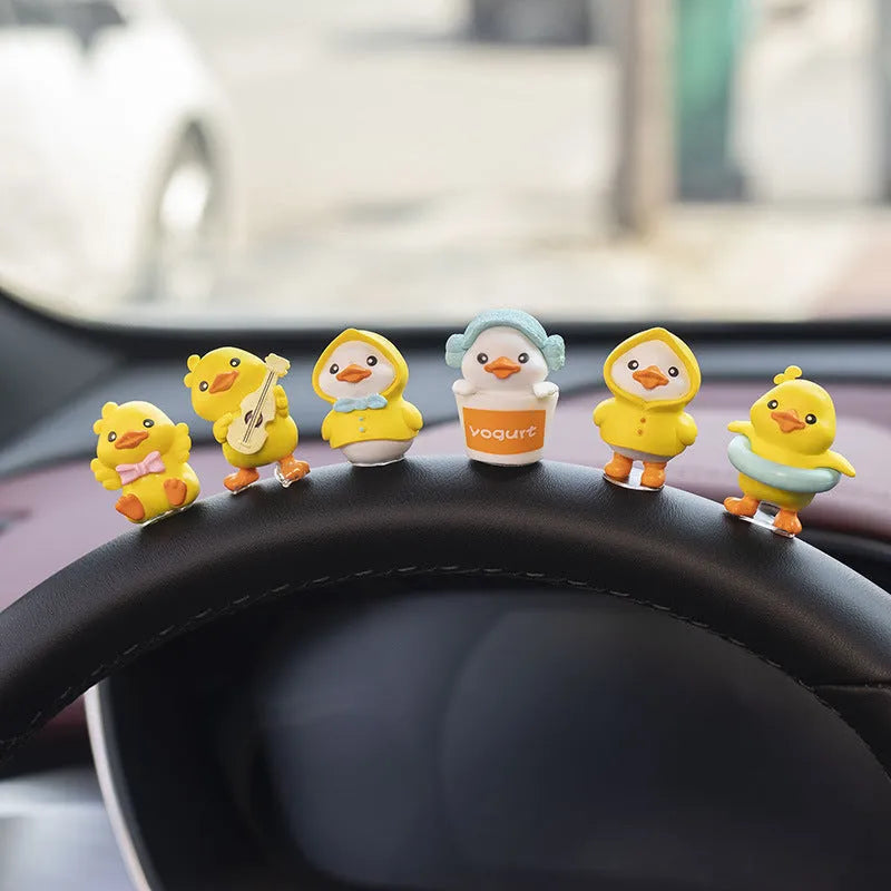 PVC duckling car interior decoration set with six small ducks and one sign on car dashboard