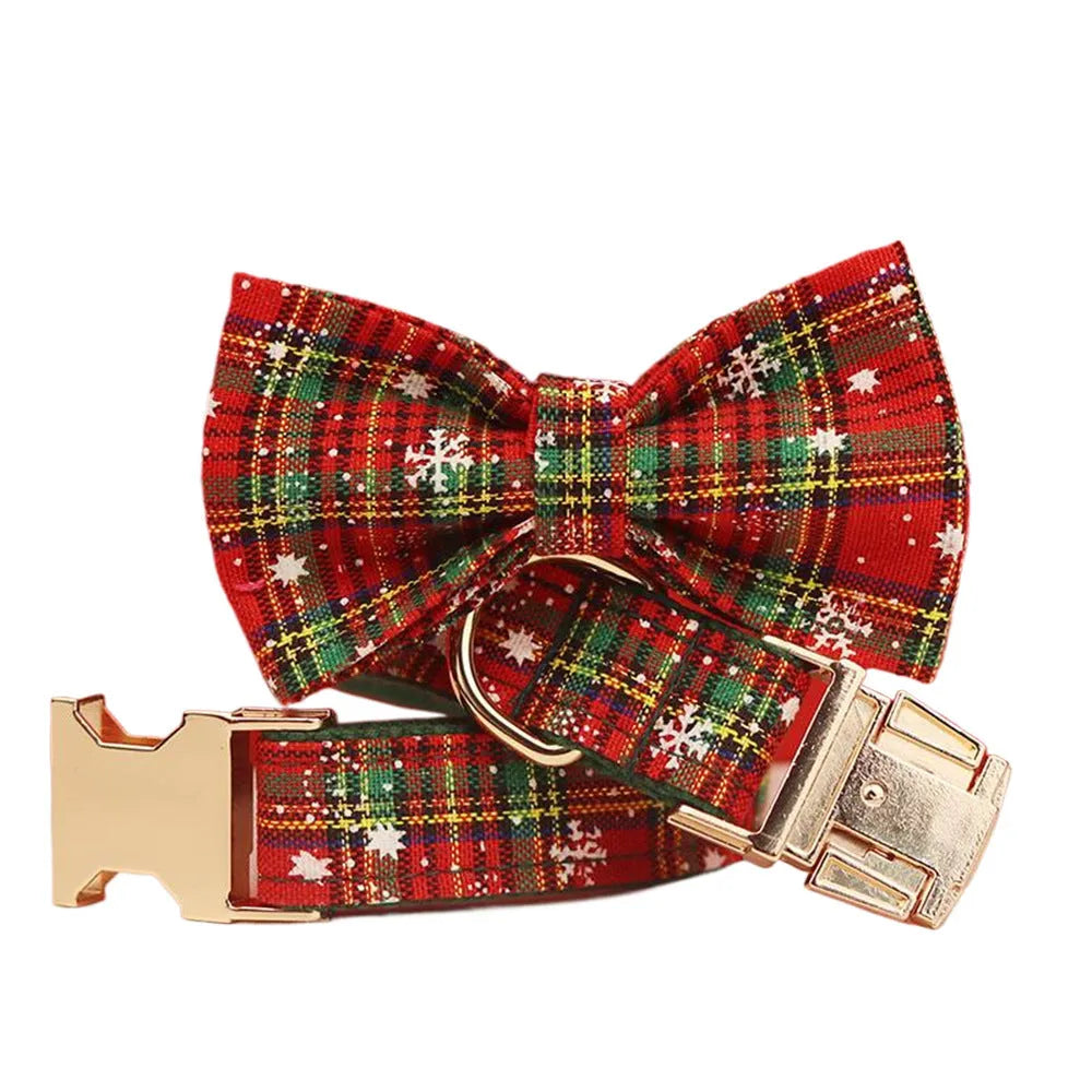 Green snowflake patterned cloth dog collar set with matching vest, leash, and bow for Christmas