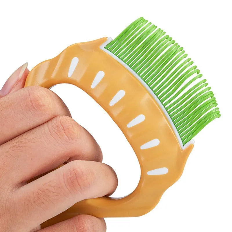 Shell-shaped pet grooming brush in green, orange, or purple with bent wire bristles and anti-slip handle