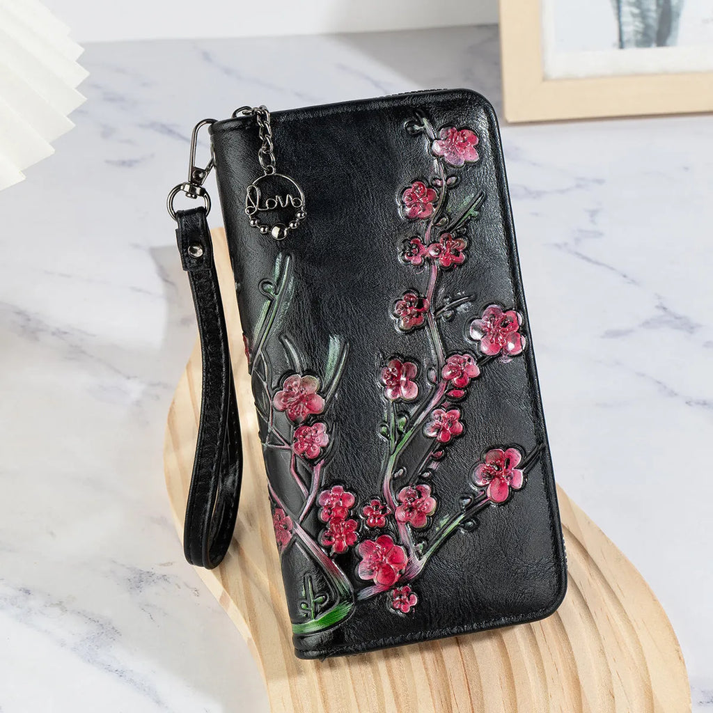 Embossed and hand-painted floral pattern on a brown Chinese-style zipper handbag.